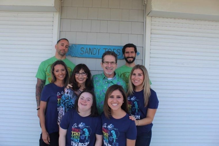 Claudia DeFabio (front, at right) spoke out on behalf of her sister Glenda (left), who has Down syndrome, after the youngest of the family's five siblings was left out of her high school yearbook.  