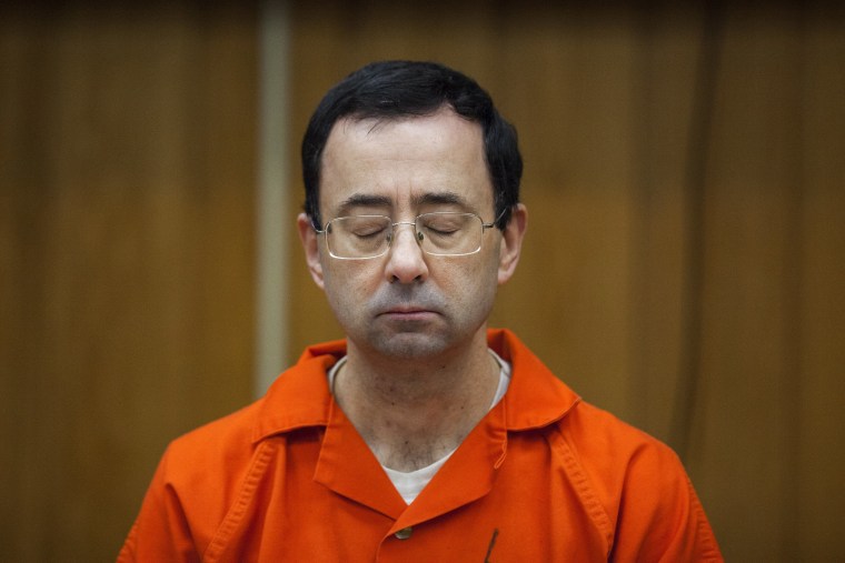 Image: Larry Nassar listens during his sentencing at Eaton County Circuit Court in Charlotte,