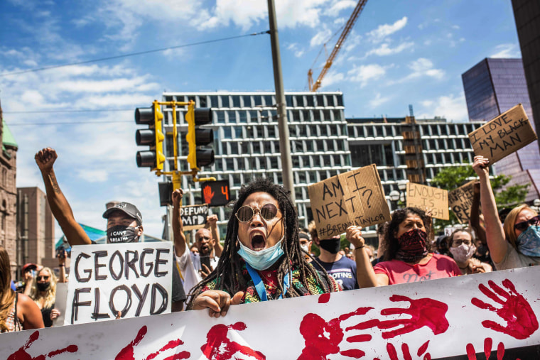 Image: Protesters march near the Minneapolis Police 1st Precinct on June 13, 2020.