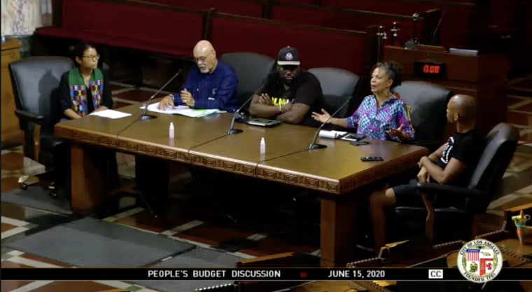 Image: David Turner, third left, and Melina Abdullah, second right, at the  Los Angeles City Council meeting