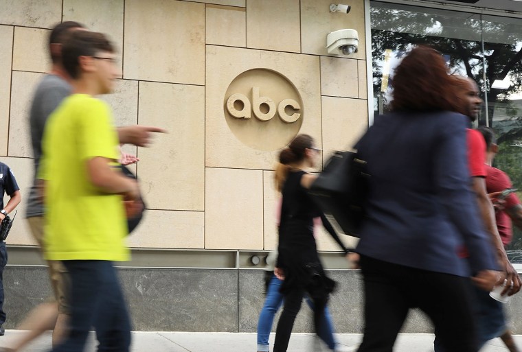 Pedestrians pass ABC headquarters in New York.