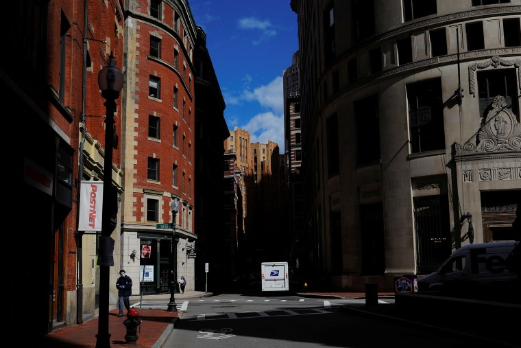 A U.S. Postal Service truck is parked in the nearly empty financial district in Boston on May 12, 2020, amid the coronavirus disease outbreak.