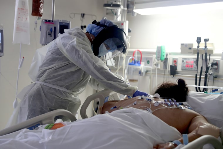 Image: FILE PHOTO: A medical staff member treats a patient suffering from the coronavirus disease (COVID-19) in the Intensive Care Unit (ICU), at Scripps Mercy Hospital in Chula Vista