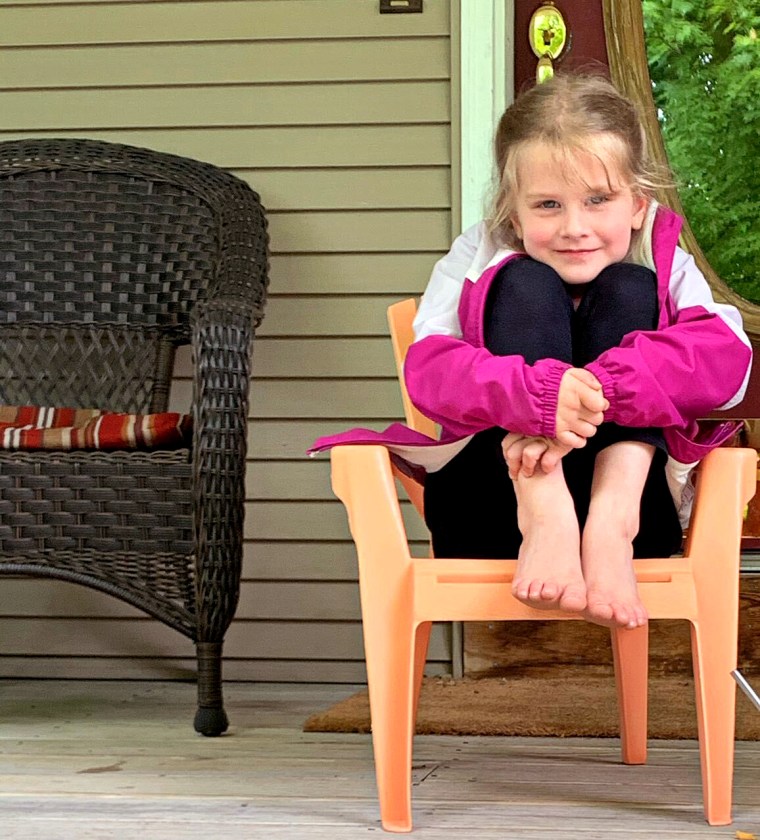 Remy Curran, 5, has learned to obediently sit on her grandmother's porch during her mom's visits to avoid catching the coronavirus instead of running up to hug her mom.