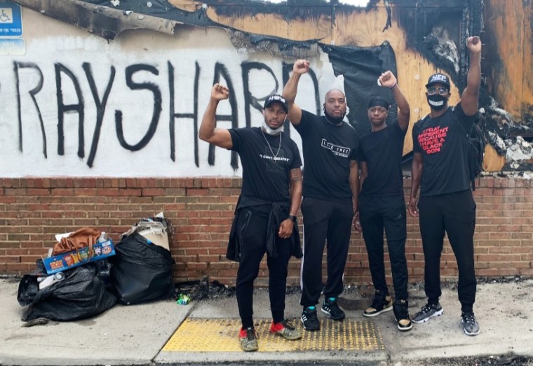 Channing Baker, left, and friends marched to protest the killing of Rayshard Brooks in Atlanta.