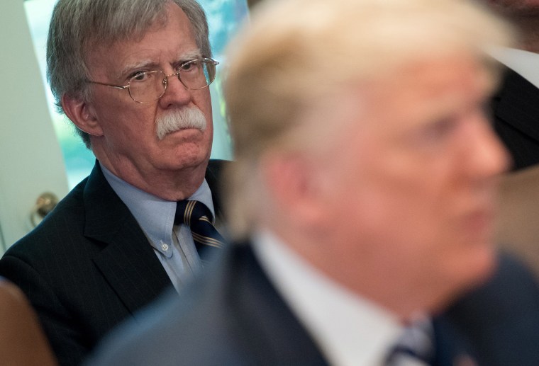 Image: President Donald Trump speaks alongside National Security Adviser John Bolton during a Cabinet Meeting in the Cabinet Room of the White House.