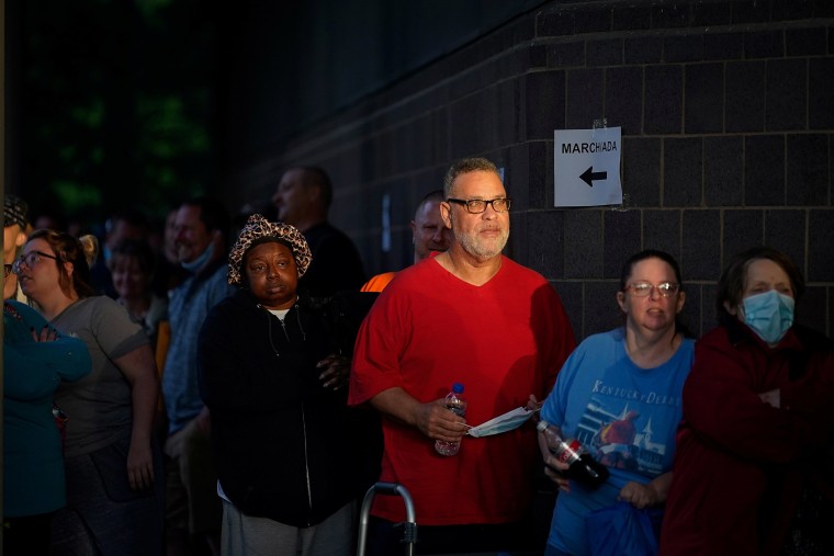Image: Hundreds of people line up outside the Kentucky Career Center, over two hours prior to its opening, to find assistance with their unemployment claims in Frankfort, Kentucky