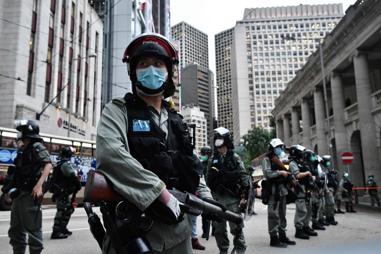 Image: Riot police stand guard ahead of a pro-democracy march in Hong Kong