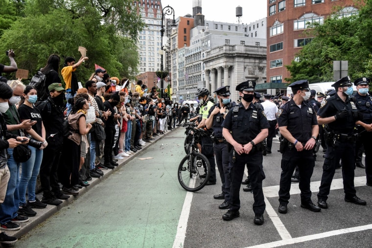 Image: Protesters gather near police during a rally against the death of George Floyd in New York on May 28, 2020.