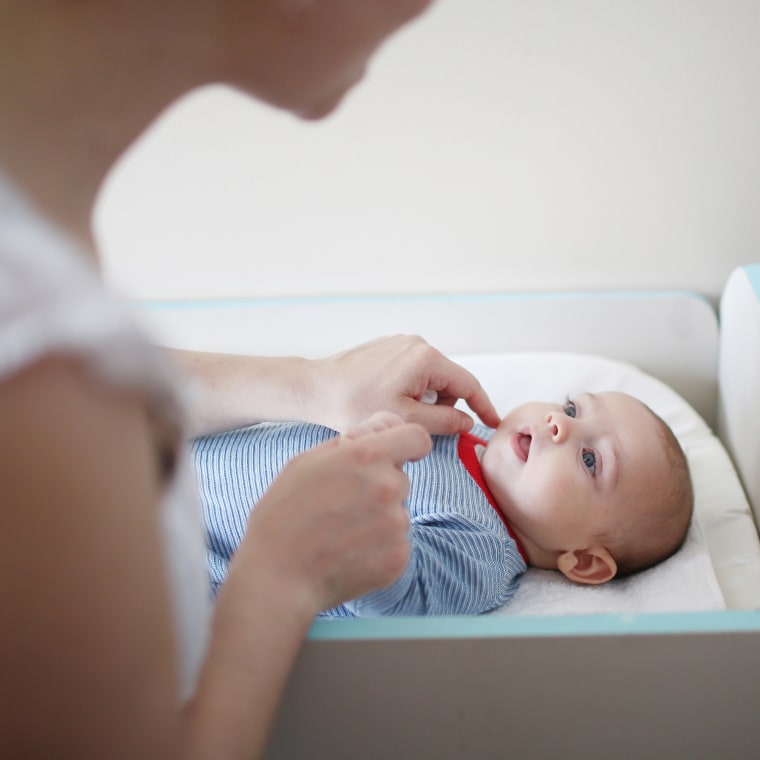 A 2 months baby boy on his changing table