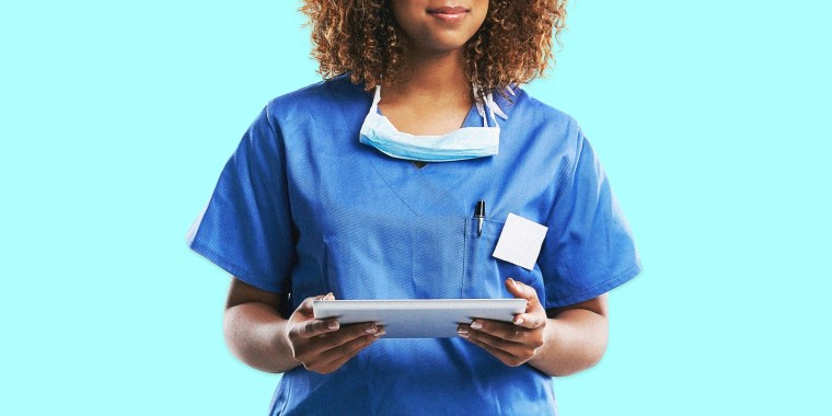 Image: A Black woman doctor in blue scrubs on a bright blue background.