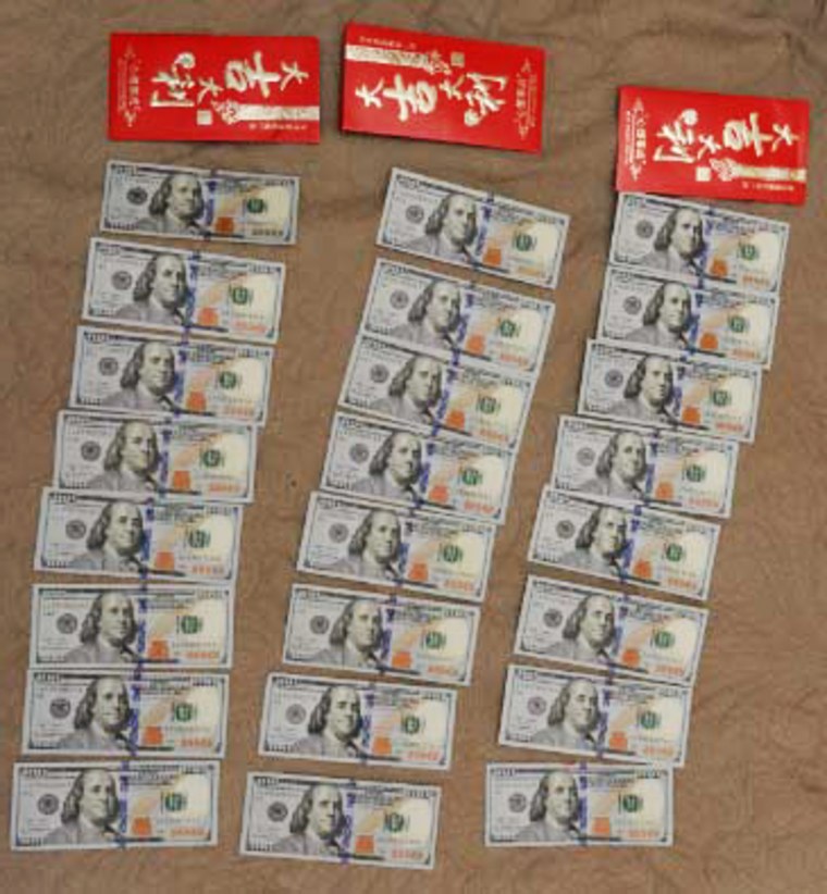 Agents found cash in red envelopes with Chinese characters