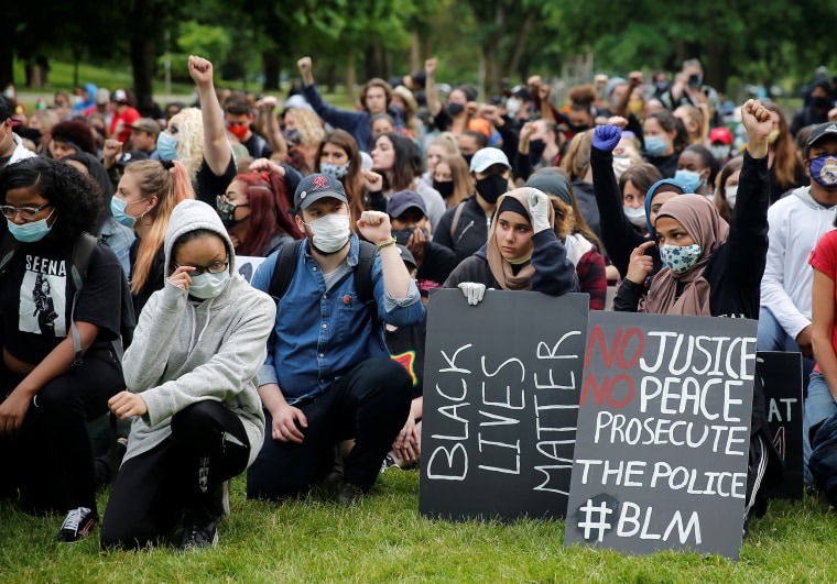 Black Lives Matter protesters take a knee during a rally in Tacoma, Wash., on June 5, 2020.