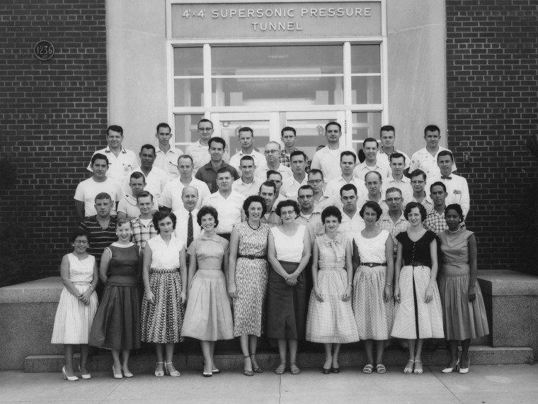 Image: Mary Jackson, first row, far right, stands with staff in front of the 4 foot by 4 foot Supersonic Pressure Tunnel in the 1950's.