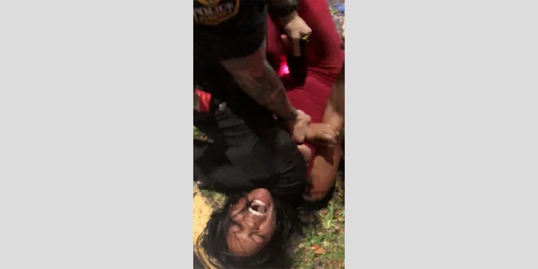 Image: Miami officer charged, knee to throat