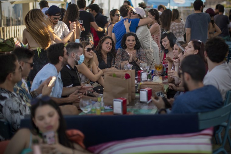 Image: Customers in a tapas bar in Barcelona, Spain,