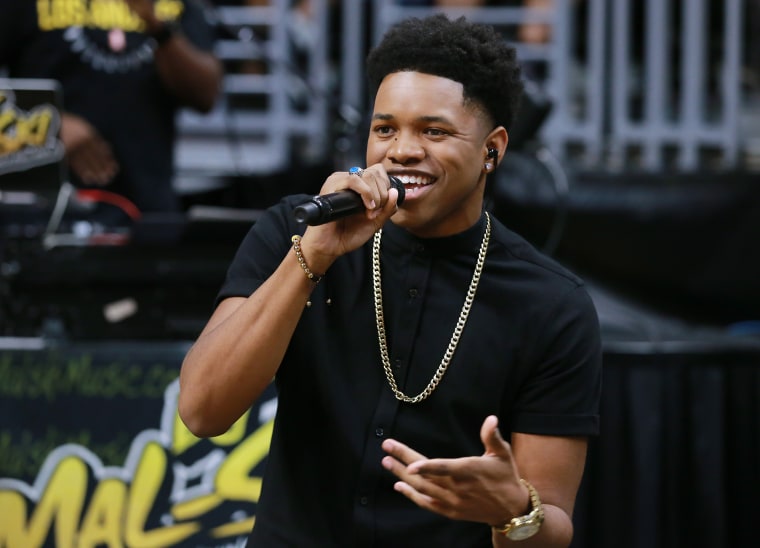 Nathan Davis Jr. performs during a WNBA basketball game in Los Angeles
