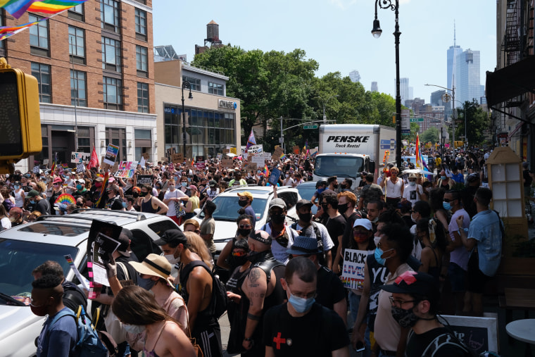 The Queer Liberation March passes Washington Place and Sixth Avenue toward The Stonewall Inn in New York City on June 28, 2020.