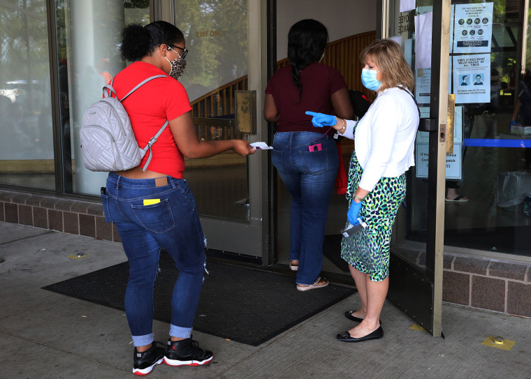 Image: People Wait In Line To File For Unemployment Benefits In Frankfort, Kentucky