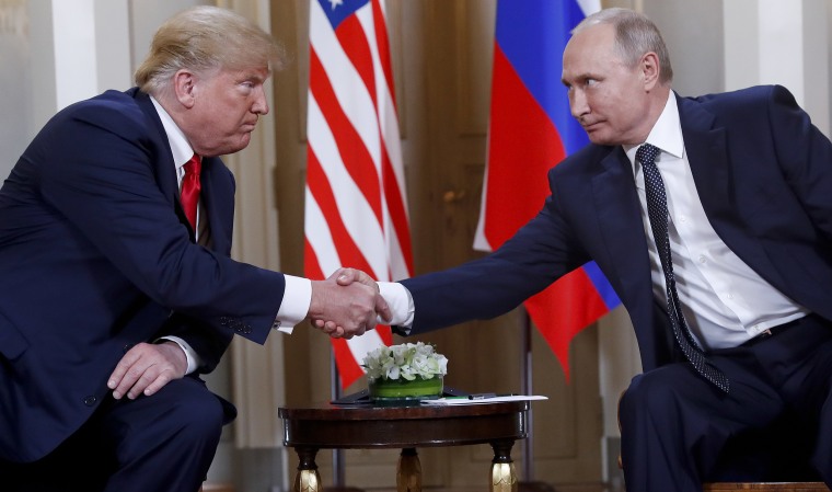 Image: Trump and Putin shake hands in Helsinki