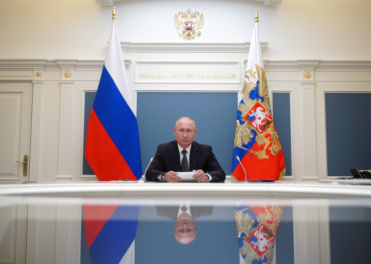Image: Russian President Putin takes part in a video conference call in Moscow