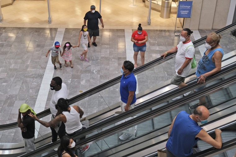 Shoppers walk around Garden State Plaza mall in Paramus, N.J., June 29, 2020.