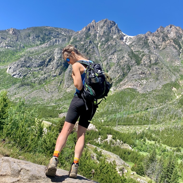 Wearing black ODODOS workout shorts with tummy control while hiking in Montana