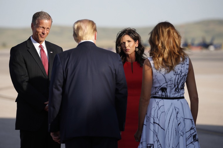 Image: Sen. John Thune, R-S.D., and Gov. Kristi Noem greet President Donald Trump and first lady Melania Trump upon arrival at Ellsworth Air Force Base