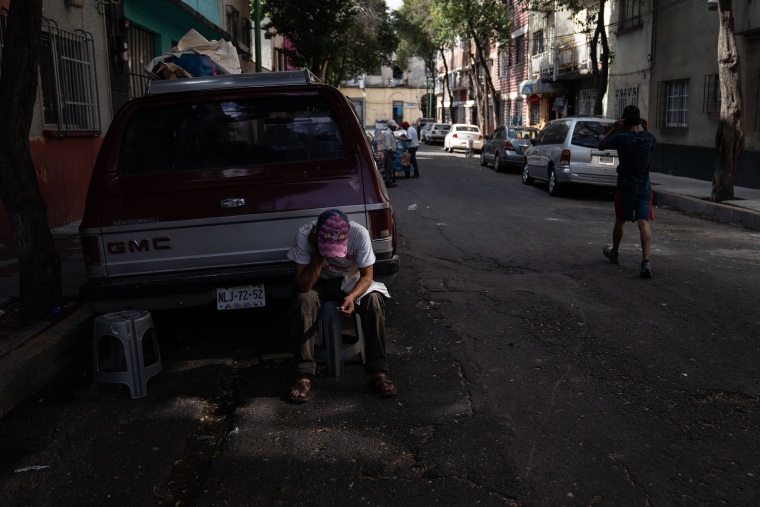 Image: Juan Rodr?guez Molina, 32, sits next to a sidewalk in the Buenavista neighborhood on June 19, 2020 in Mexico City, Mexico