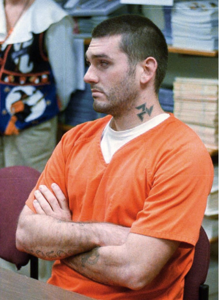 Image: Daniel Lee Lewis waits for his arraignment hearing for murder in the Pope County Detention Center in Russellville, Ark. on Oct. 31 1997.