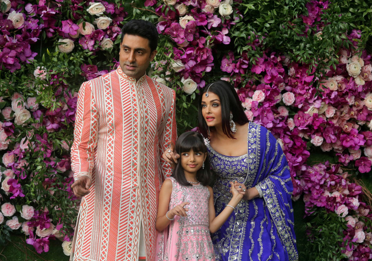 Image: Indian film actors Abhishek Bachchan, his wife Aishwarya Rai and their daughter Aaradhya in Mumbai, India
