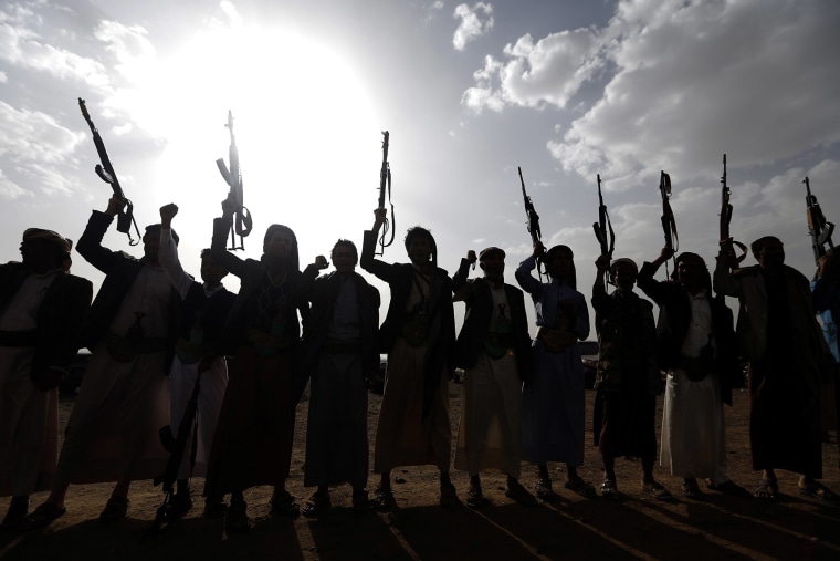 Image: Yemen's Shiite Huthi rebels shout slogans during a gathering to mobilise more fighters to battlefronts to fight pro-government forces, in the Yemeni capital Sanaa.