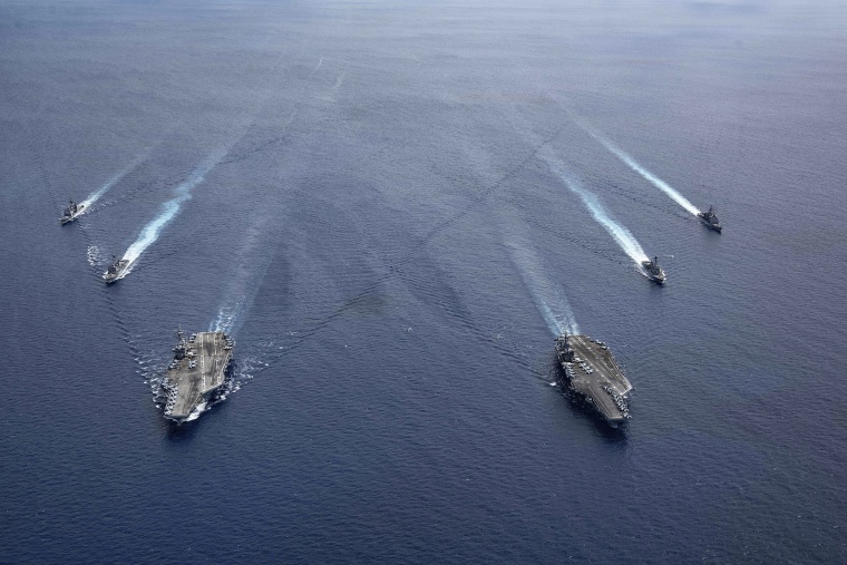 Image: The USS Ronald Reagan (CVN 76) and USS Nimitz (CVN 68) Carrier Strike Groups steam in formation, in the South China Sea