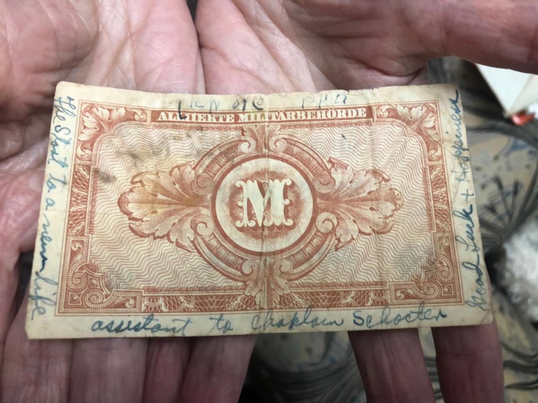Image:  This banknote with messages of hope and kindness written around the edges was given to Lilly Ebert by American soldier Hyman Schulman upon liberating her from the Nazi regime during WWII.