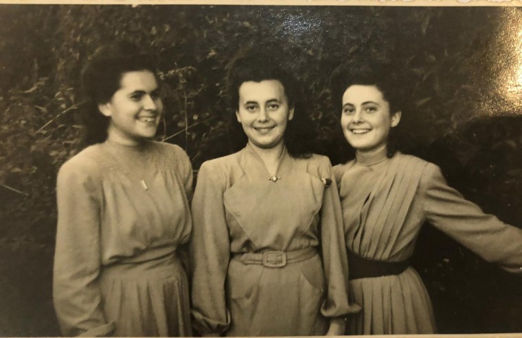 Image: Lily Ebert, center, with her sisters who were sent to Auschwitz together and endured slave labor and the death march during WWII.