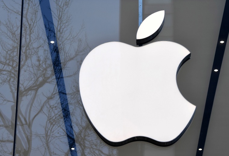 Image: The Apple logo on display on the facade of an Apple store in Brussels.