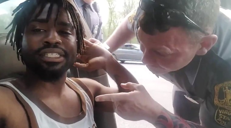 Virginia State Trooper C. Hewitt and Derrick Thompson during a traffic stop.