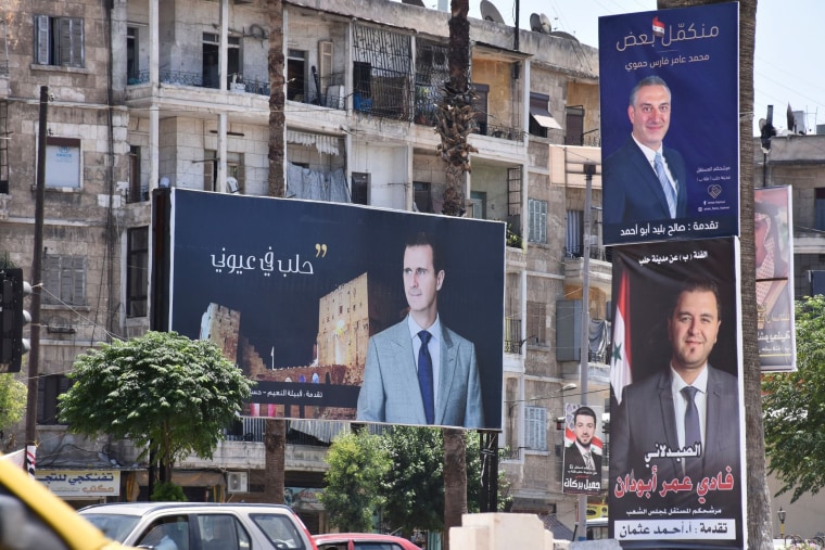Image: Campaign posters of candidates in Syria