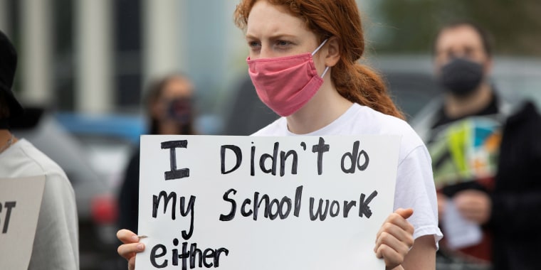 White students join in protests in support of a Black high school student who was jailed after not keeping up with her online schoolwork during the coronavirus pandemic.