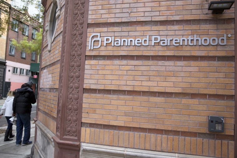 People walk past a Planned Parenthood clinic in the Manhattan borough of New York