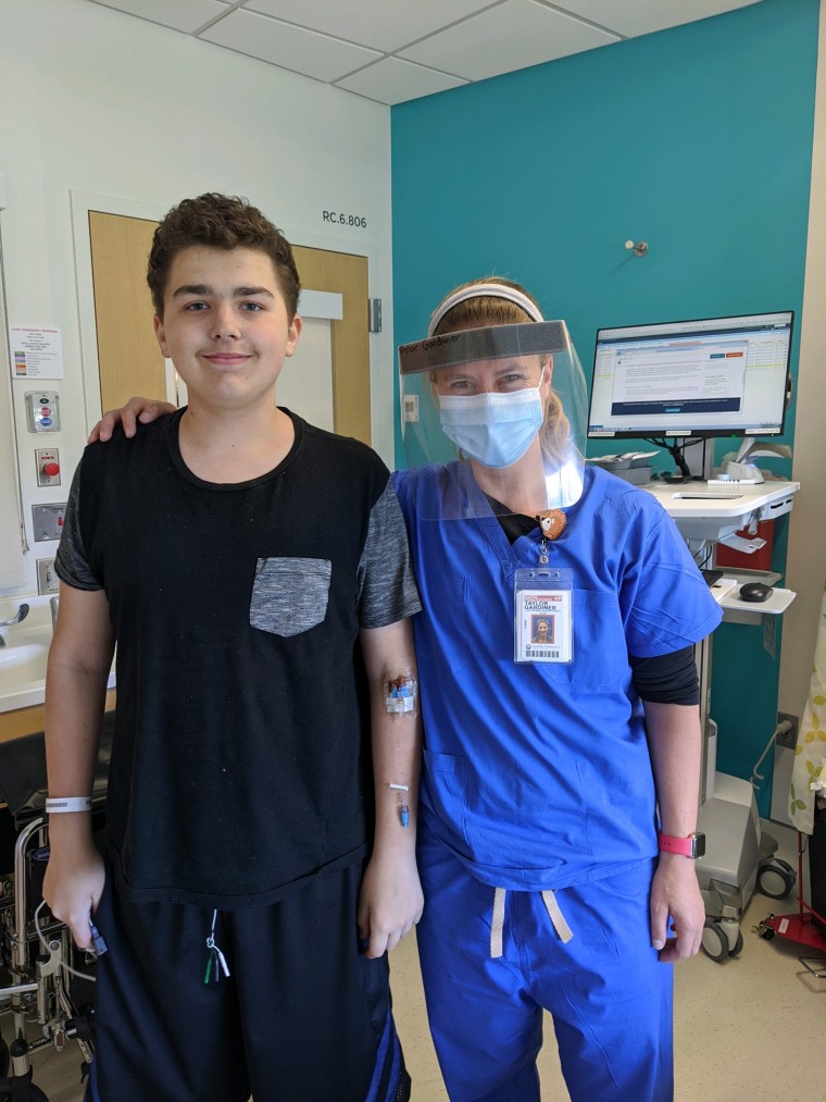 Anthony and one of his nurses on the day he was discharged.