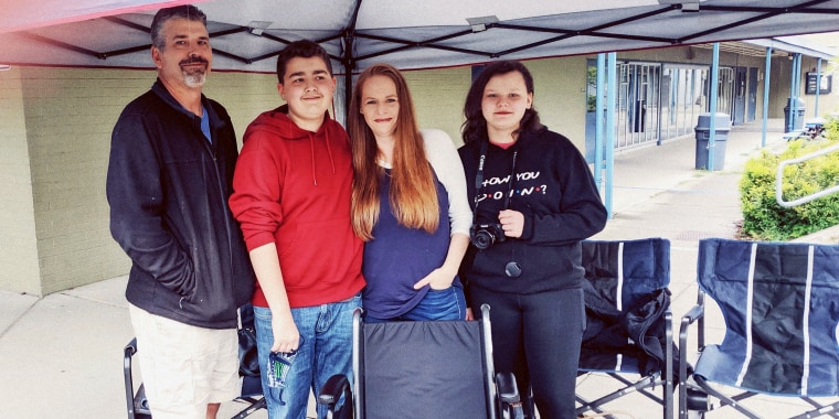 Anthony Lawson, his parents and younger sister at his 14th birthday car parade on May 30, 2020. During Anthony's first weeks home from the hospital, he often became too dizzy and exhausted to walk, so he needed a wheelchair, in the foreground.