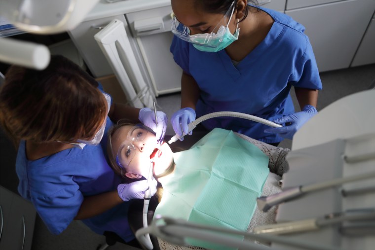 Dentists may wear more protective gear than usual. 