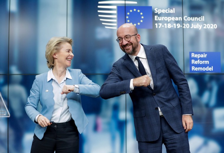 Image: European Council President Charles Michel and European Commission President Ursula Von Der Leyen do an elbow bump at the end of a news conference following a four-day European summit at the European Council in Brussels,