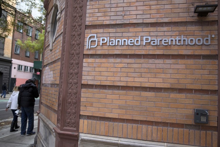 People walk past a Planned Parenthood clinic in the Manhattan borough of New York
