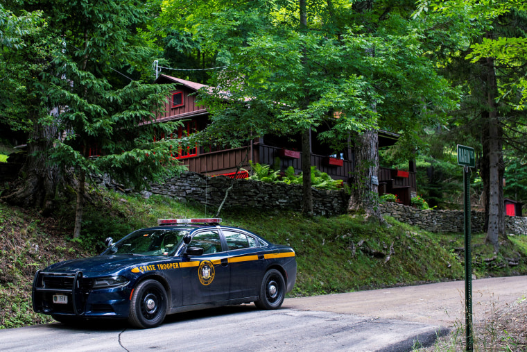 A New York State Trooper stands guard outside the home where attorney Roy Den Hollander was found dead after allegedly killing the son of federal judge Esther Salas and wounding her husband, in Catskills, N.Y., on July 20, 2020.
