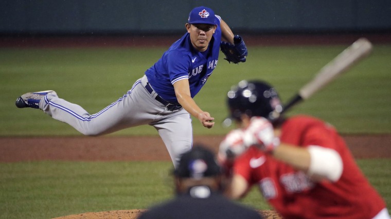 Image: Toronto Blue Jays pitcher Shun Yamaguchi delivers during the fourth inning of an exhibition baseball game against the Boston Red Sox