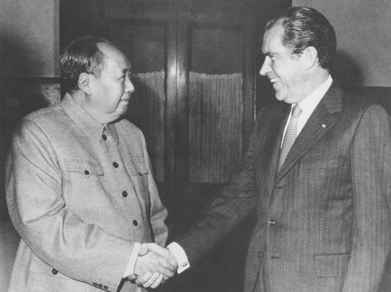 Image: Chinese communist party leader Mao Zedong, left, and U.S. President Richard Nixon shake hands as they meet in Beijing