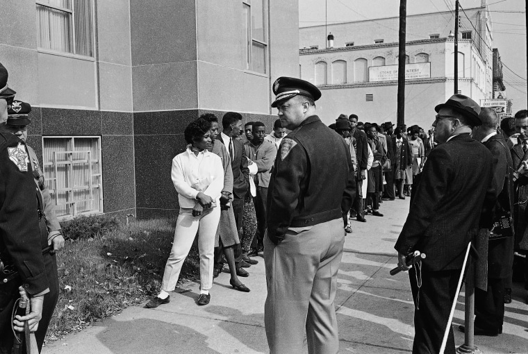 Image: Sheriff Jim Clark, Dallas County Selma, Alabama, stands in front of a group of African-Americans