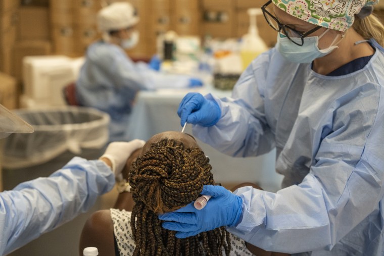 Medical workers from New York test for the coronavirus disease (COVID-19) at a temporary testing site in Houston on July 17, 2020.